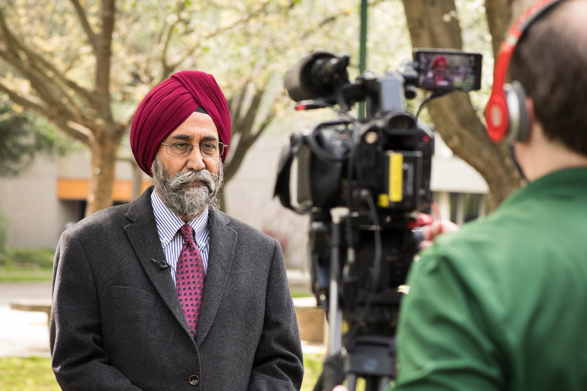 Professor Rekhi Singh being interviewed by the media